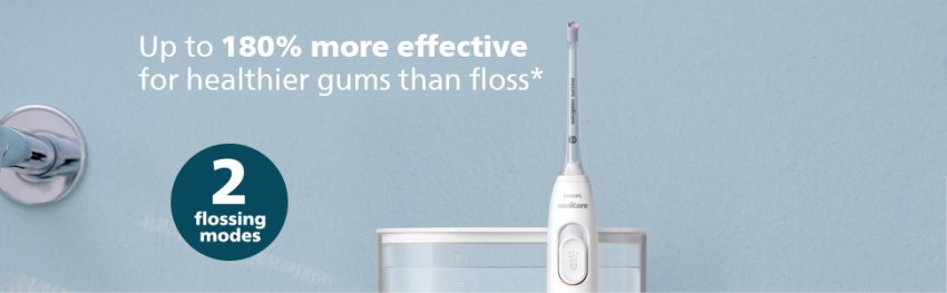 power flosser against blue background