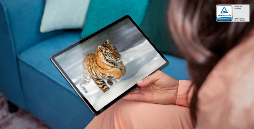 Woman holding Lenovo Tab P11 Pro in her lap watching tiger video