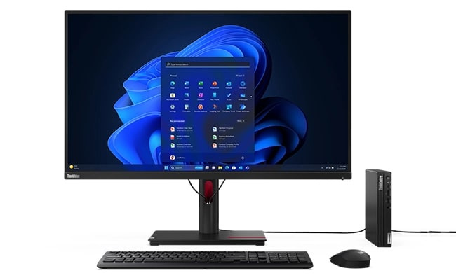Lenovo ThinkCentre M70q Gen 5 Tiny 個人電腦垂直擺放在顯示器右側。