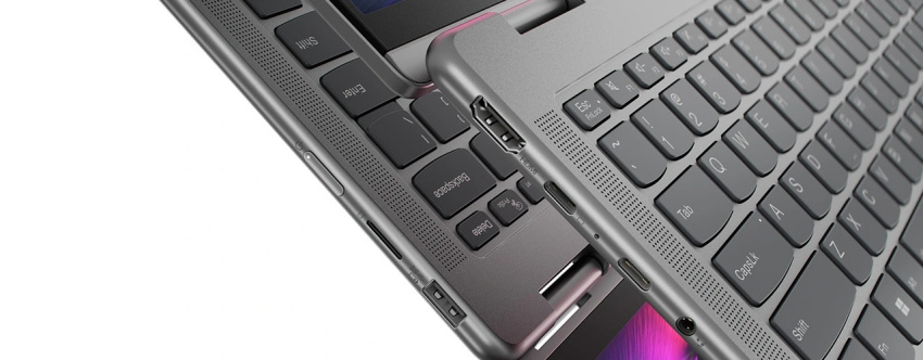 Closeup of the left and right sides of the Lenovo Yoga 7 2-in-1 Gen 9 (14 AMD) laying flat, showing ports